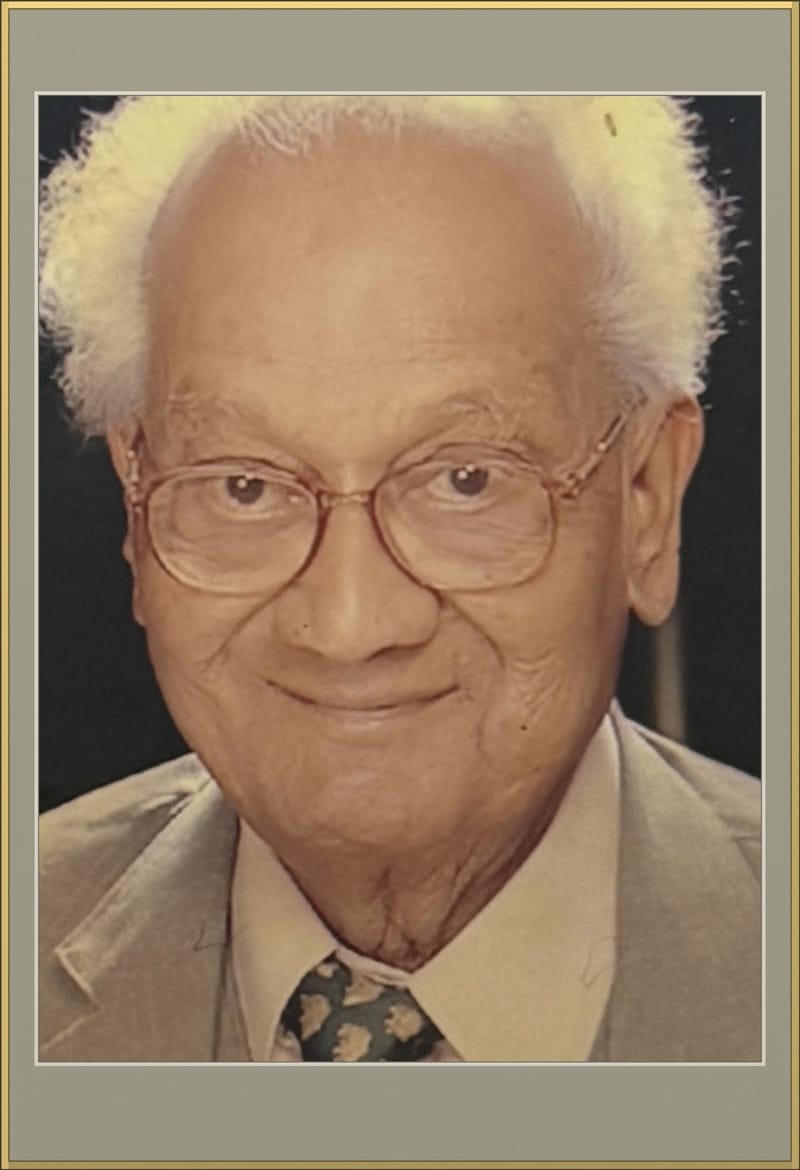Gold-framed portrait of Prof. Dr. D. K. Gupta